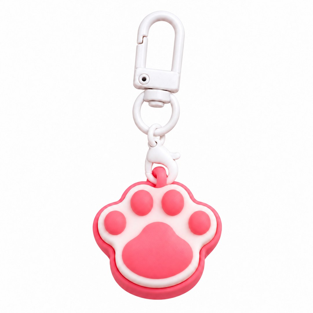 Pink and white paw print clicker keychain on a white clasp