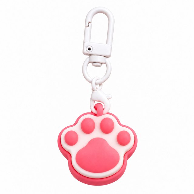 Pink and white paw print clicker keychain