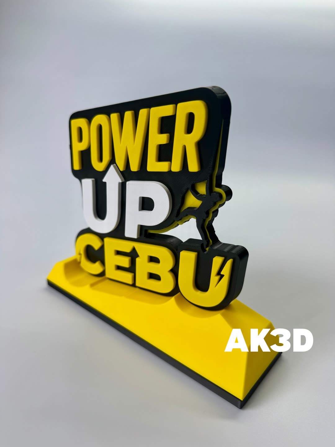 The POWER UP CEBU sign seen from an angle, showing the depth of the layered letters